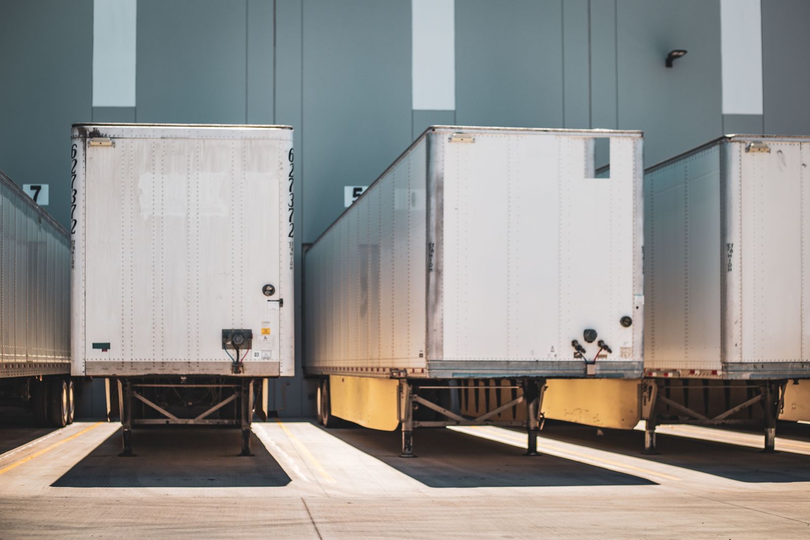 Trailers backed into warehouse loading bays